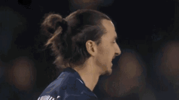 a soccer player is blowing flames out of his mouth during a game