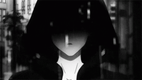 a black and white photo of a boy with a hood on his head .
