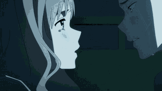 a man and a woman kissing with tears coming down their faces