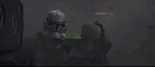 a close up of a clone trooper 's helmet with a green stripe