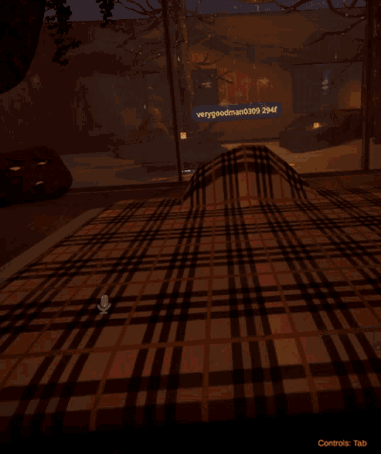 a screenshot of a video game shows a hand pointing at a microphone and the words controls tab below it