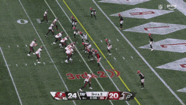 a football game between the buccaneers and the falcons is in progress