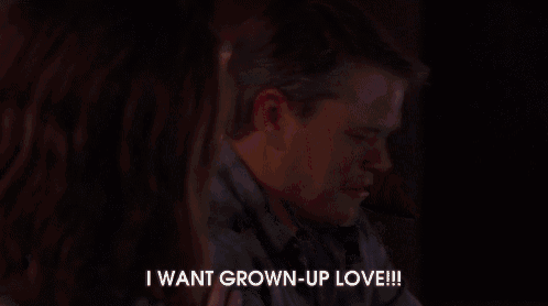 a woman sits on a couch with a man and says i want grown up love