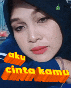 a woman wearing a hijab with the words aku cinta kamu