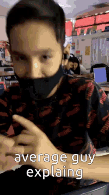 a boy wearing a mask is sitting in a classroom with the words average guy explaining written on the bottom