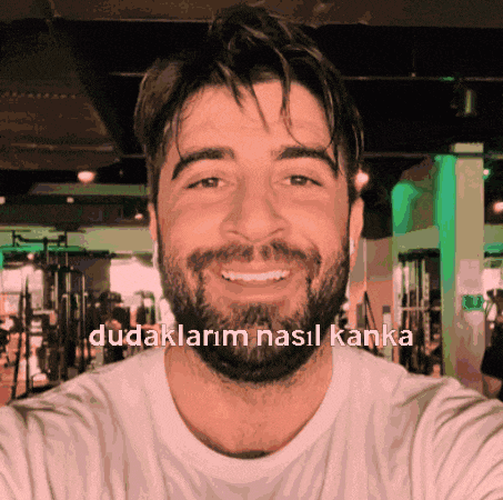 a man with a beard takes a selfie with the words dudaklarim nasil kanka written below him