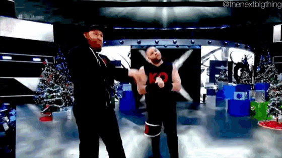 two men are dancing together in a room with christmas trees in the background .