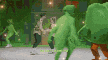 a man and a woman are ice skating in front of a green monster that says no i can t stand this