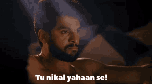 a man with a beard says tu nikal yahan se