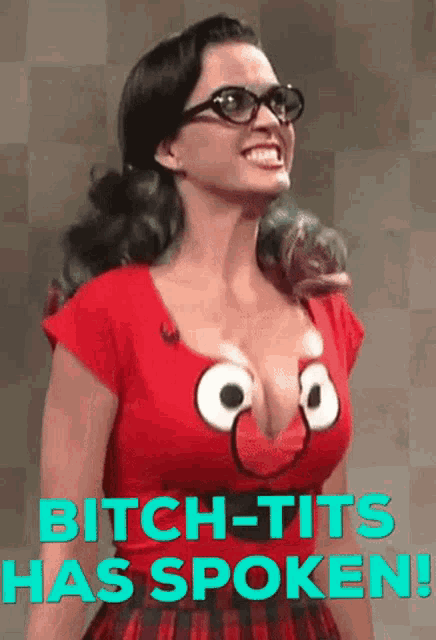 a woman wearing glasses and a red shirt that says bitch tits has spoken on it