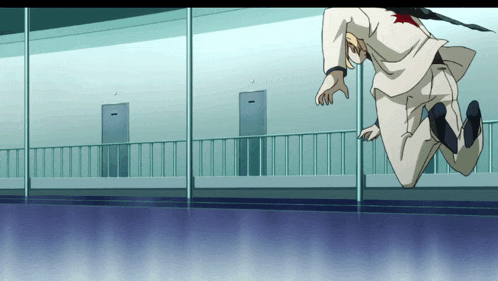 a man in a white suit jumps in the air