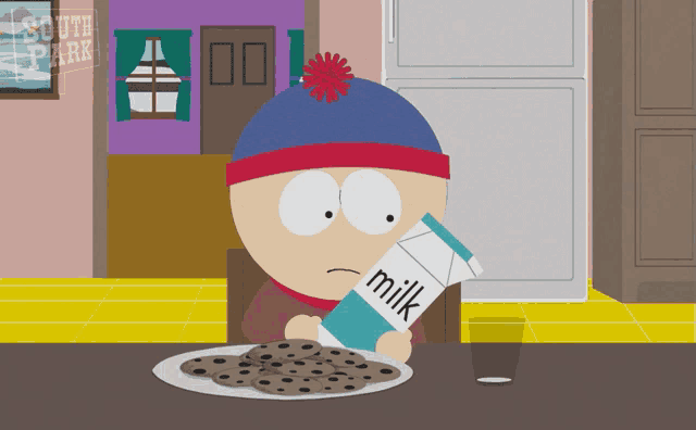 stan marsh from south park sits at a table with a carton of milk and a plate of cookies