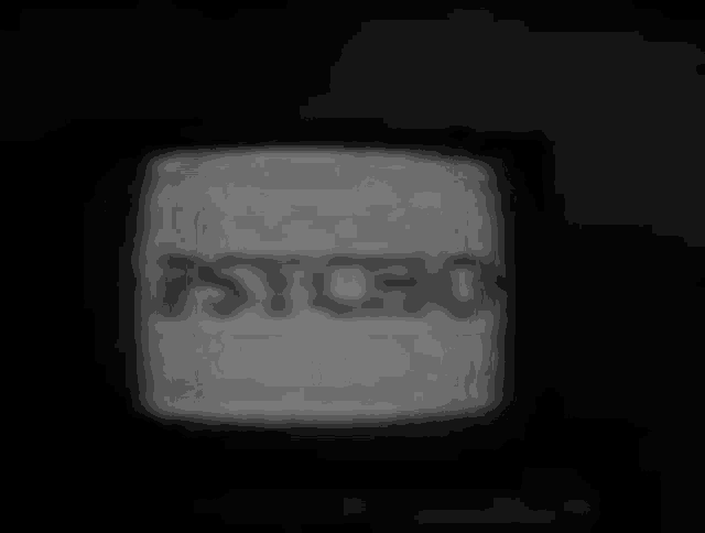 a black and white photo of a television screen with the word psycho on it .