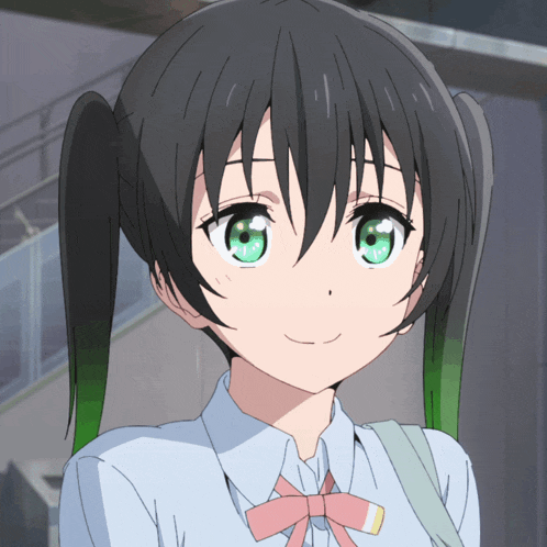 a girl with pigtails has green eyes and a pink bow