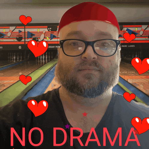 a man with glasses and a beard is surrounded by red hearts and the words no drama