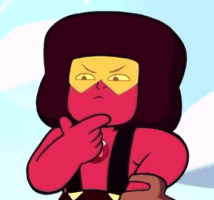 a close up of a cartoon character with a red and yellow face .