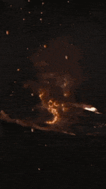 a large explosion in the sky with a lot of flames coming out of it