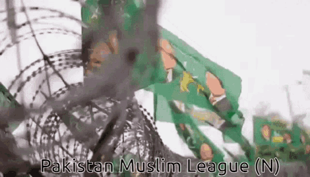 a barbed wire fence with the words pakistan muslim league ( n ) written on it