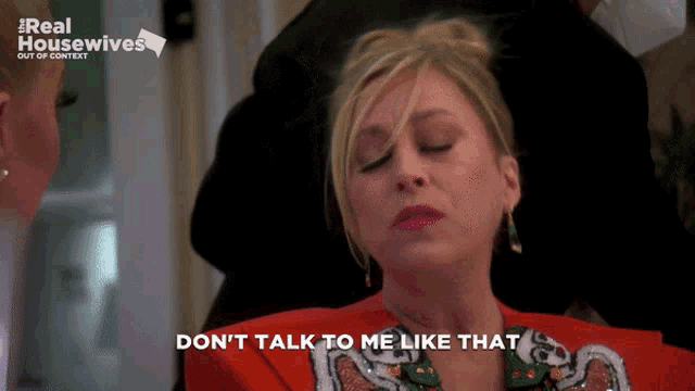 a woman says " do n't talk to me like that " in front of a real housewives logo
