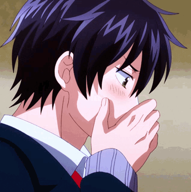 a close up of a person covering their face with their hands