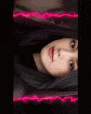 a woman 's face is split in half by a neon glowing border