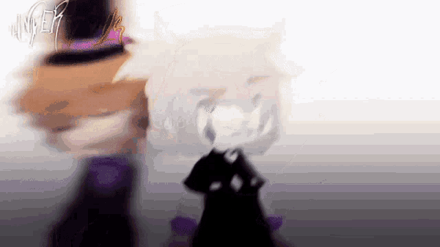 a blurry picture of a person wearing a hat and a black dress