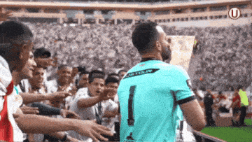 a soccer player with the number 1 on his shirt