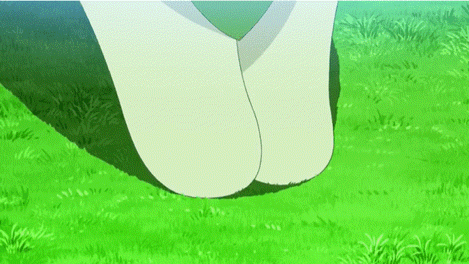 a close up of a person 's feet on a grassy field