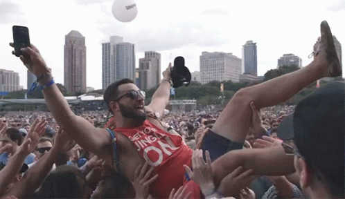 Crowd Surfing Passed On Overhead GIF - Crowd Surfing Passed On Overhead Having A Good Time GIFs