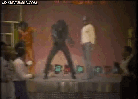 a group of people are dancing on a stage with the website mxxre.tumblr.com in the upper right corner