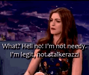 a woman is sitting on a couch with the words " what hell no i 'm not needy "