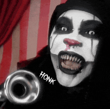 a clown is holding a trumpet with honk written on the sleeve