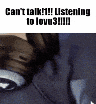 a person wearing headphones with the words can 't talk listening to lovu3