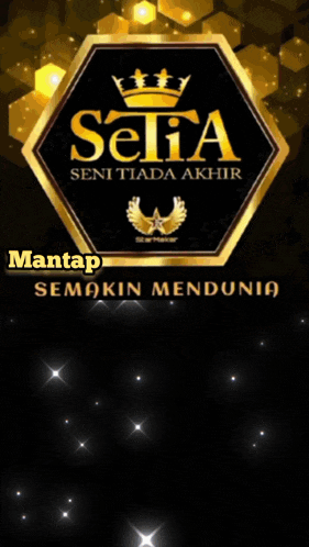 a man is giving a thumbs up in front of a sign that says setia seni tiada akhir