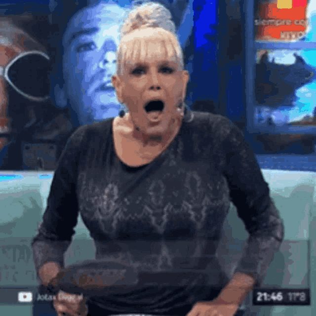 a woman with a surprised look on her face holds a purse