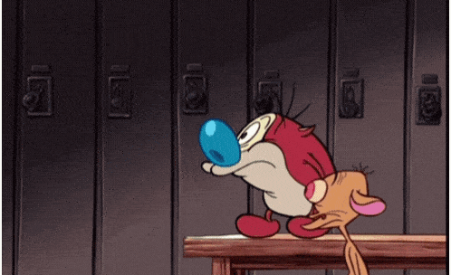 a woman in a bikini stands next to a cartoon character with a blue ball in his mouth