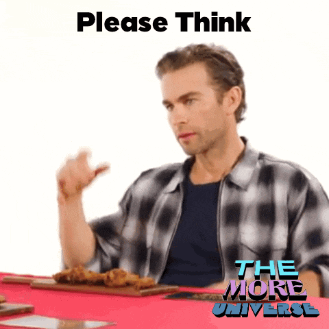 a man sitting at a table with a sign that says please think on it