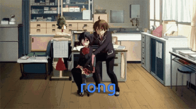 a boy and a girl are dancing in a room with the word rong in blue