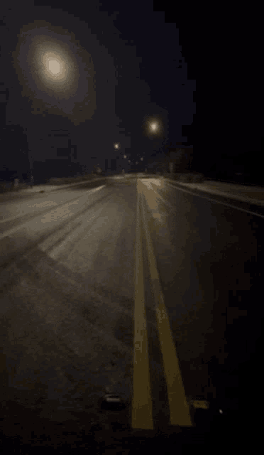 a blurred image of a person walking down a road