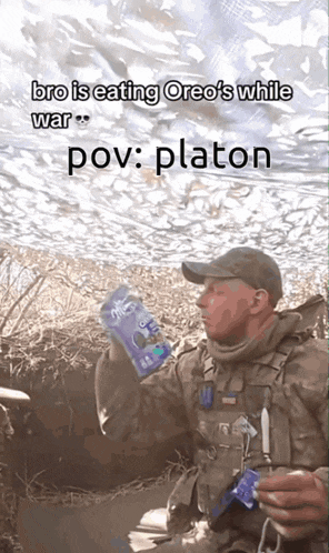 a man holding a bag of oreos with the caption " bro is eating oreos while war pov platon "