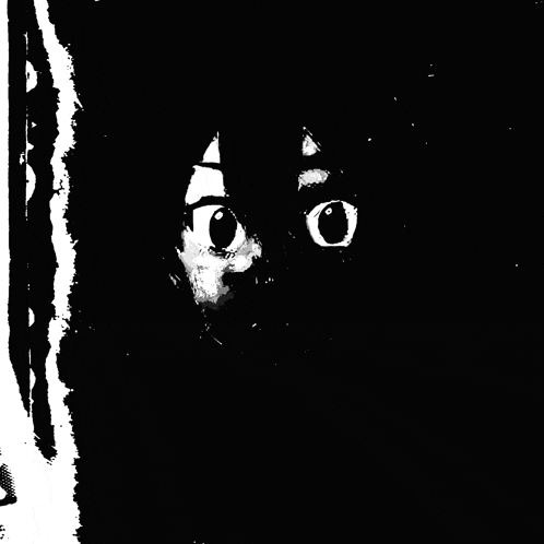 a black and white photo of a person 's face with big eyes