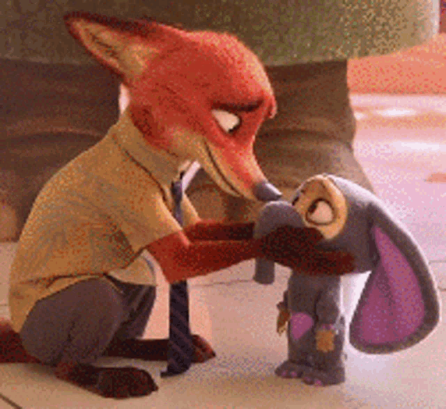 a fox is kneeling next to a stuffed animal rabbit