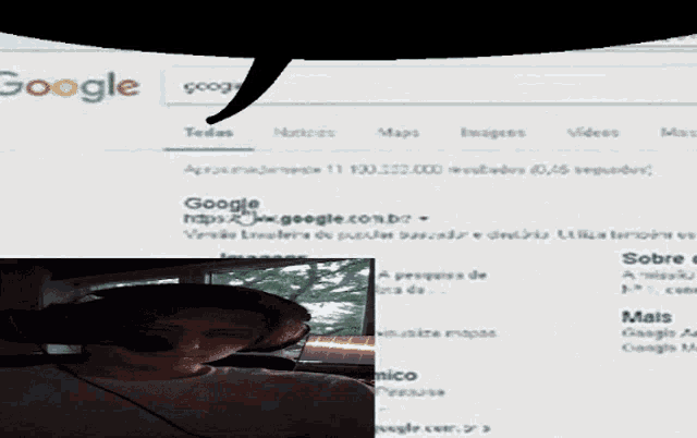 a google search page with a man wearing headphones in the foreground