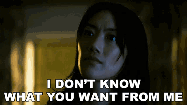 a woman says " i don 't know what you want from me " in a dark room