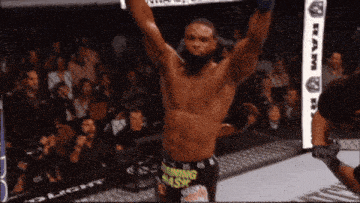 a man in a boxing ring is wearing shorts that say running smash