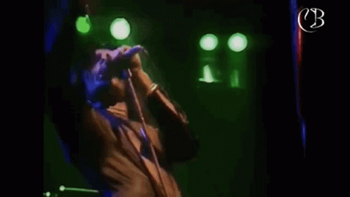Freddie Bulsara Singing GIF - Freddie Bulsara Singing Mic GIFs