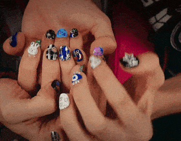 a close up of a person 's nails with a bunny design