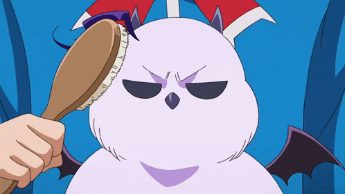 a cartoon character with horns and wings is being brushed by a person