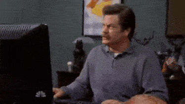 a man is typing at a dell computer