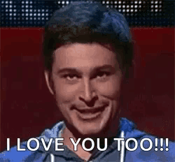 a man is sticking his tongue out and saying i love you too .